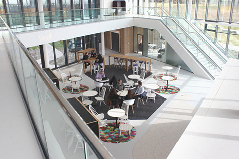 a group of people sitting at tables