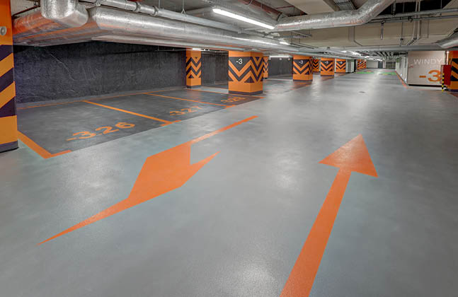 ciemnoszare miejsca postojowe i jasnoszare ciągi komunikacyjne na parkingu podziemnym Warsaw Unit